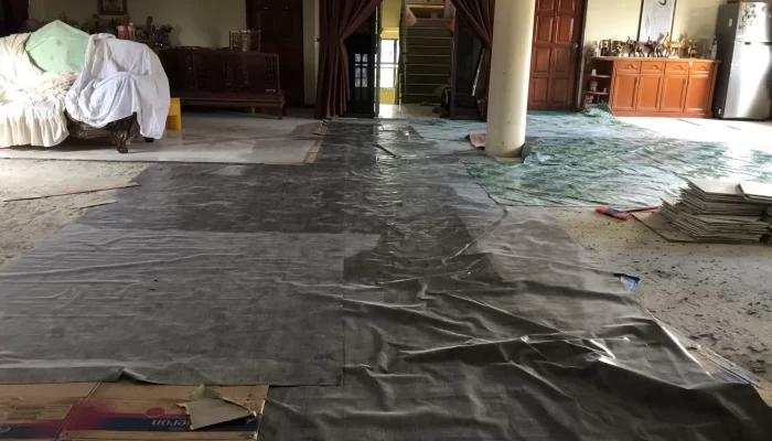 Interior of a flooded property with drying mats.